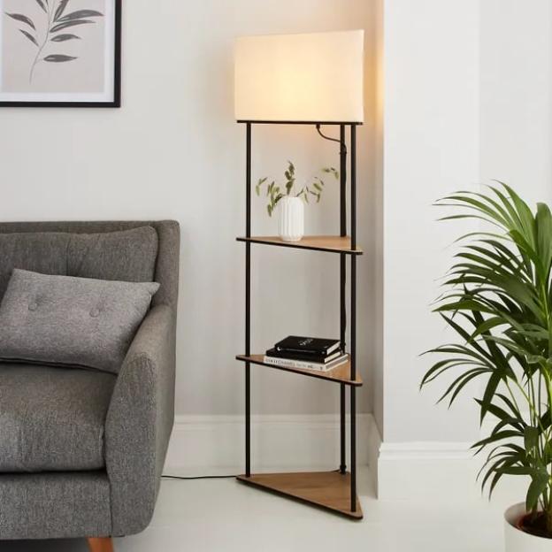 Floor lamp with three triangular shelves.