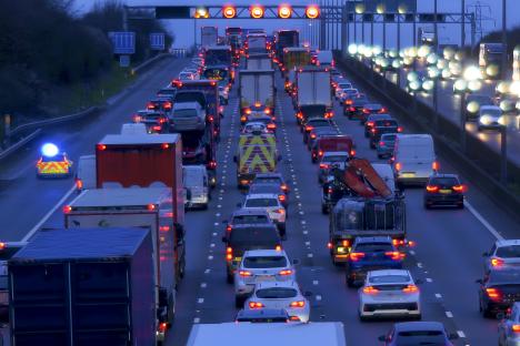 Heavy traffic jam on a highway at dusk.