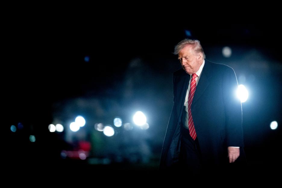 Donald Trump walking at night.