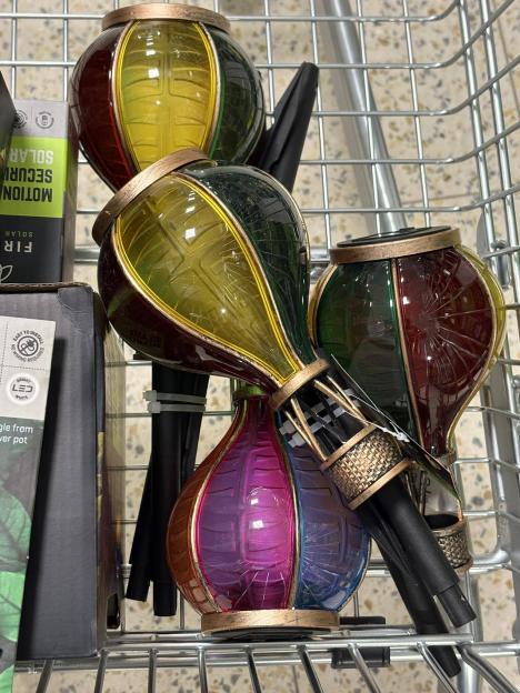 Solar-powered hot air balloon lights in a shopping cart.