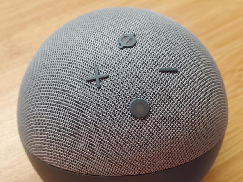 Close-up of an Amazon Echo Dot smart speaker's control buttons.