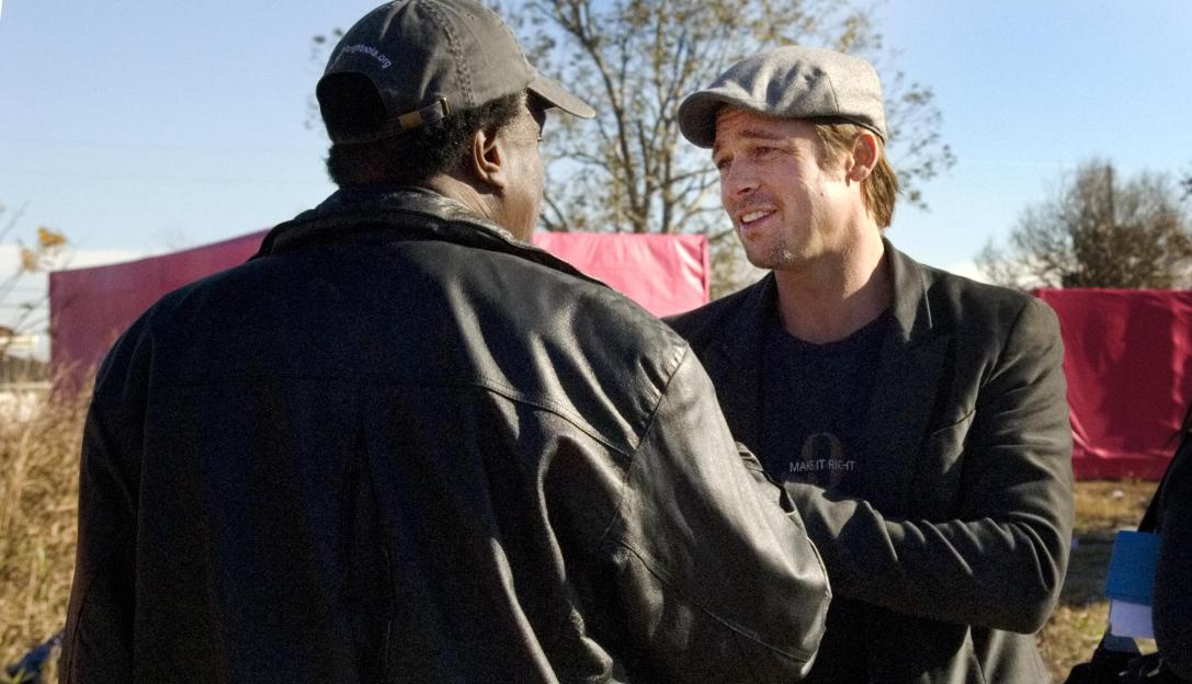 Brad Pitt speaking with a man in New Orleans' Lower 9th Ward.