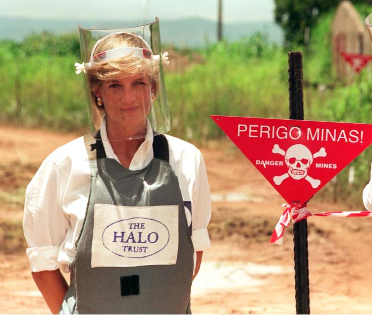 Princess Diana in Angola wearing protective gear at a landmine site.