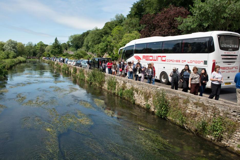 We live in England’s ‘most beautiful village’ but we’re overrun with annoying tourists – now we want to BAN coaches