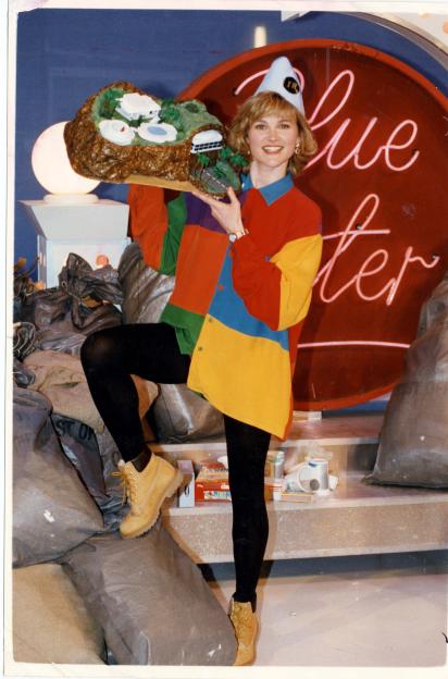 Anthea Turner on Blue Peter holding a model of Tracy Island.