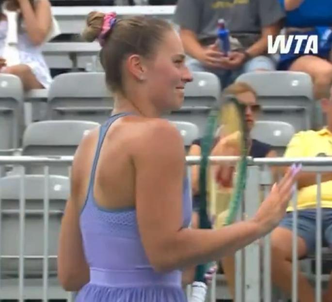 Tennis player in purple dress.