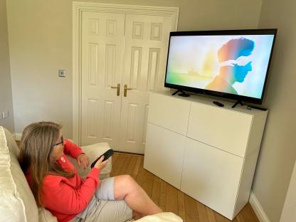 Woman watching TV.