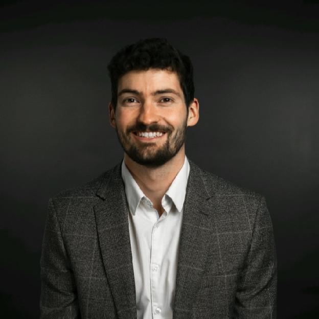 Portrait of a smiling man in a suit.