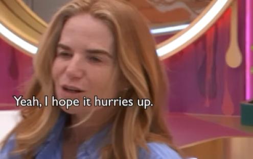 Woman saying, "Yeah, I hope it hurries up."