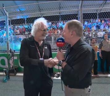 Two men shaking hands during a Sky Sports interview.