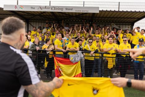 Over 100 Spanish fans at a non-league soccer game.