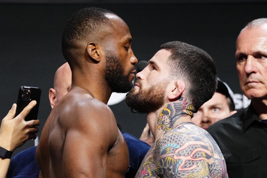 Leon Edwards and Sean Brady facing off at a UFC weigh-in.