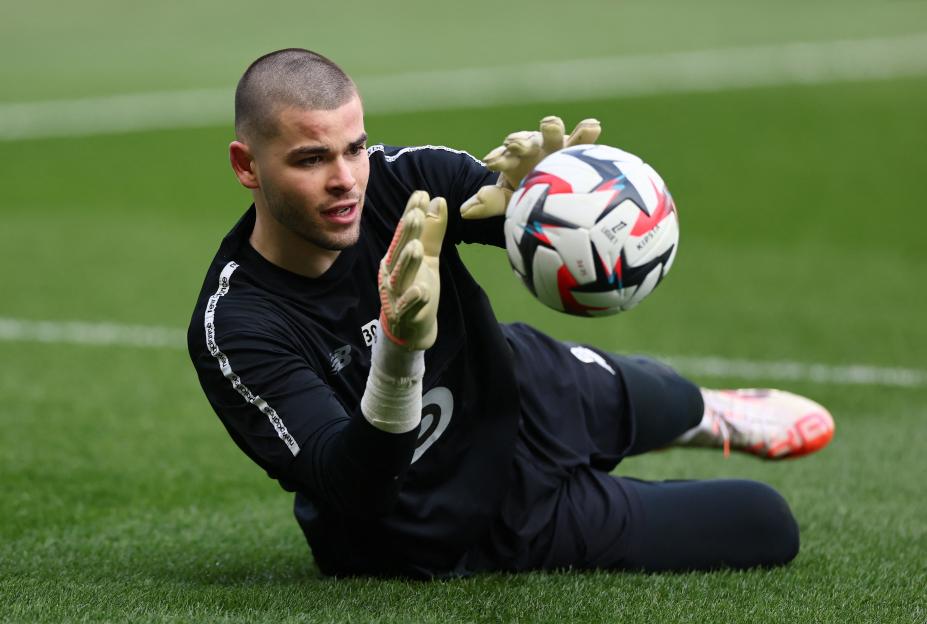 Lille's Lucas Chevalier warming up before a soccer match.