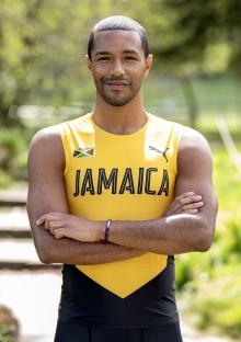 Portrait of Michael Gunning, former GB swimmer, wearing a Jamaica team shirt.