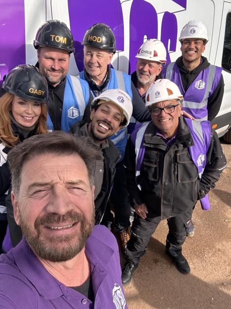 Group photo of Nick Knowles and the DIY SOS team.