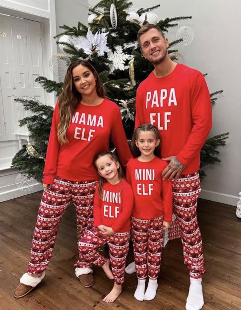 Family in matching Christmas pajamas.