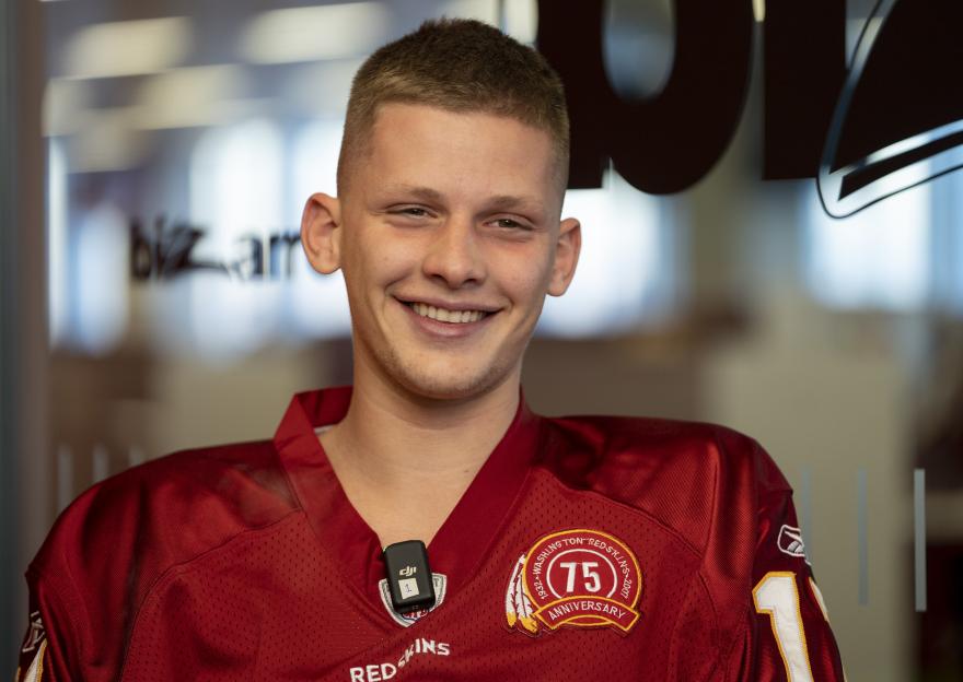 Young man in Washington Redskins jersey.