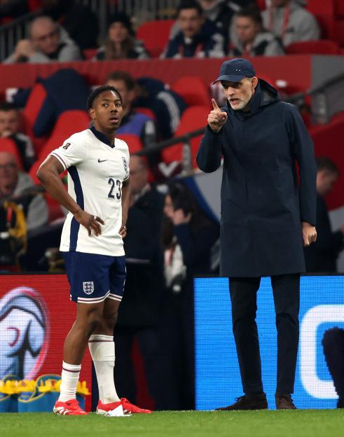 Thomas Tuchel coaching an England soccer player.