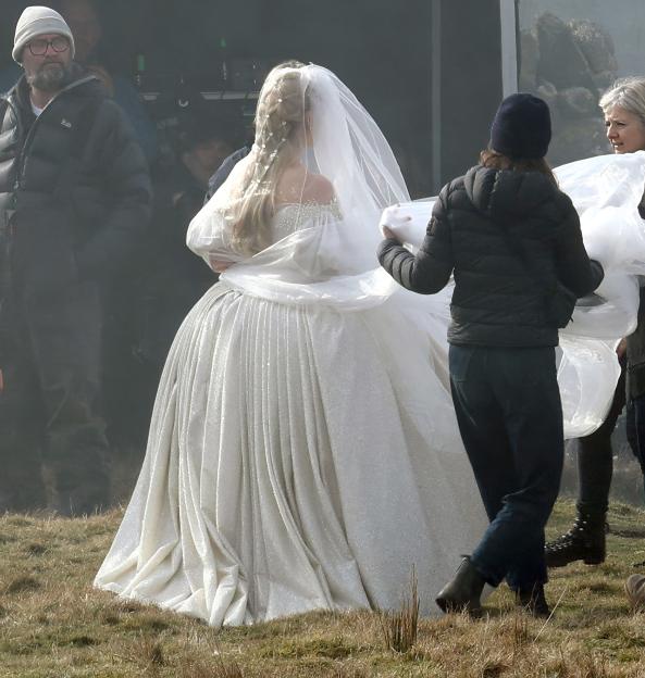 Margot Robbie in a wedding dress on the set of *Wuthering Heights*.