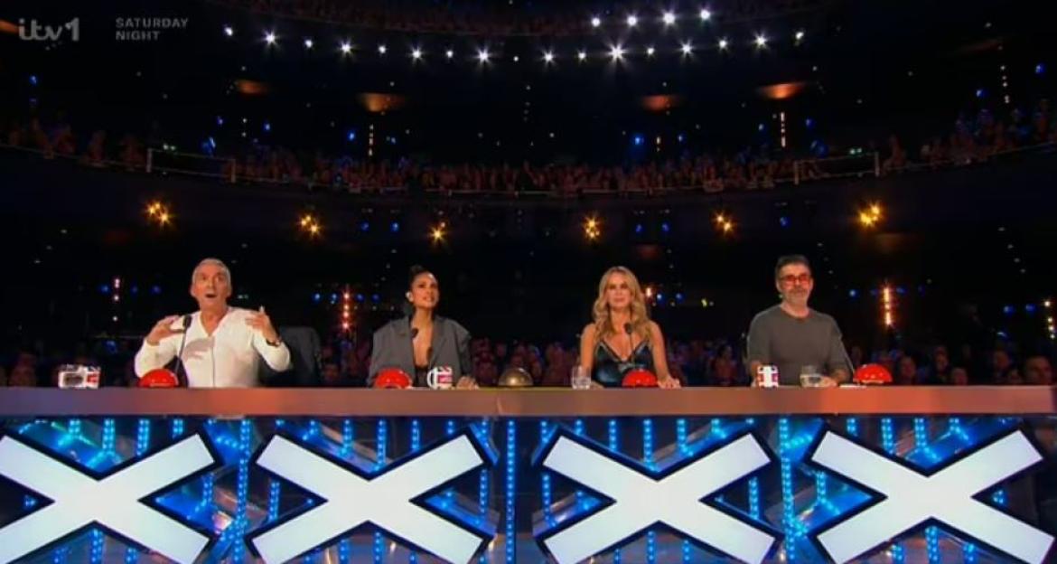 Britain's Got Talent judges Simon Cowell, Alesha Dixon, Amanda Holden, and Bruno Tonioli at the judges' table.