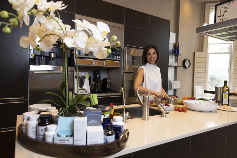 Woman preparing food in a modern kitchen.