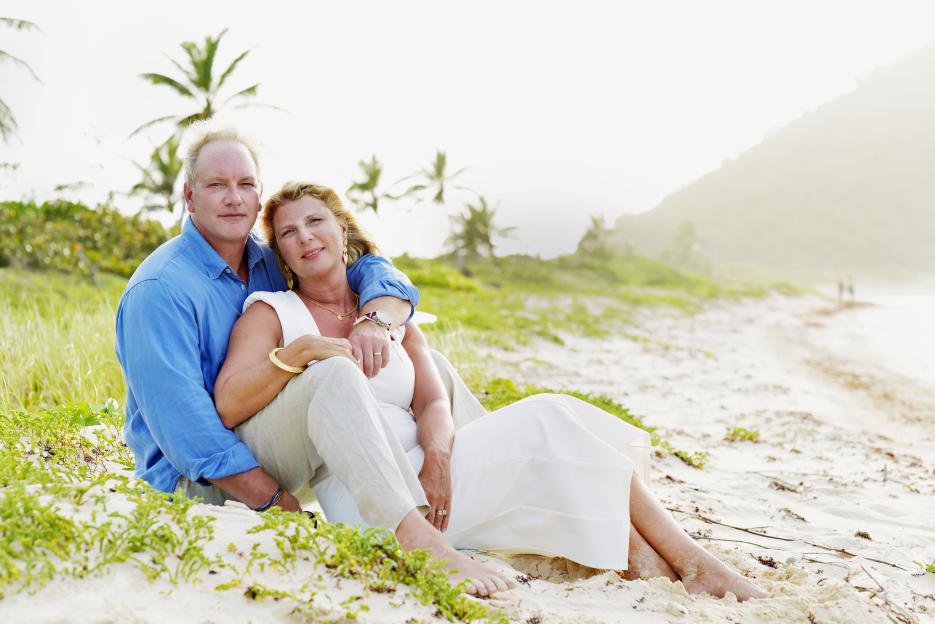 Couple sitting on a beach.