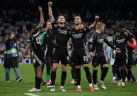 Arsenal players celebrating a victory.