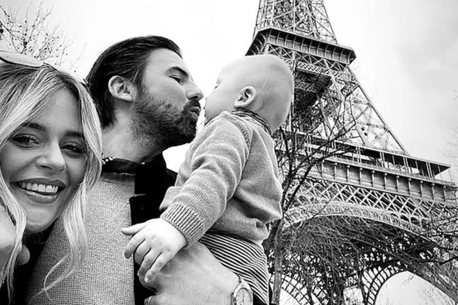 Emily Atack cosies up to boyfriend Alastair on romantic Paris trip as they take baby son to the Eiffel Tower