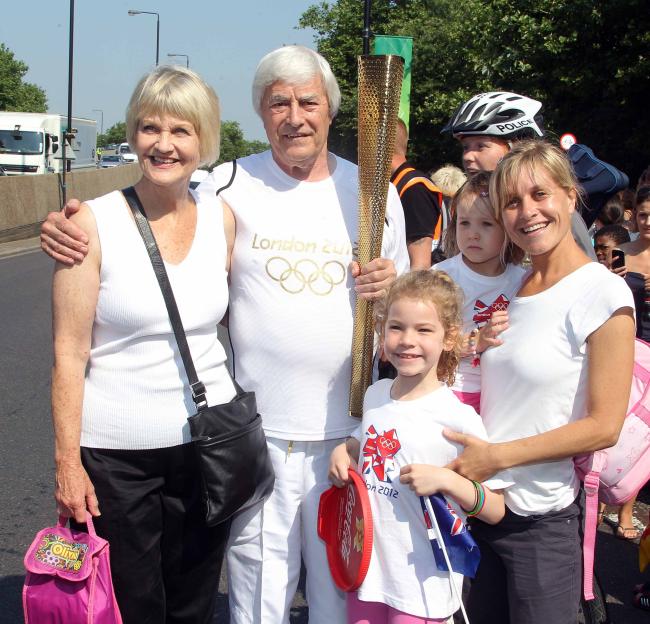 A Sun reporter and his family with the Olympic torch.