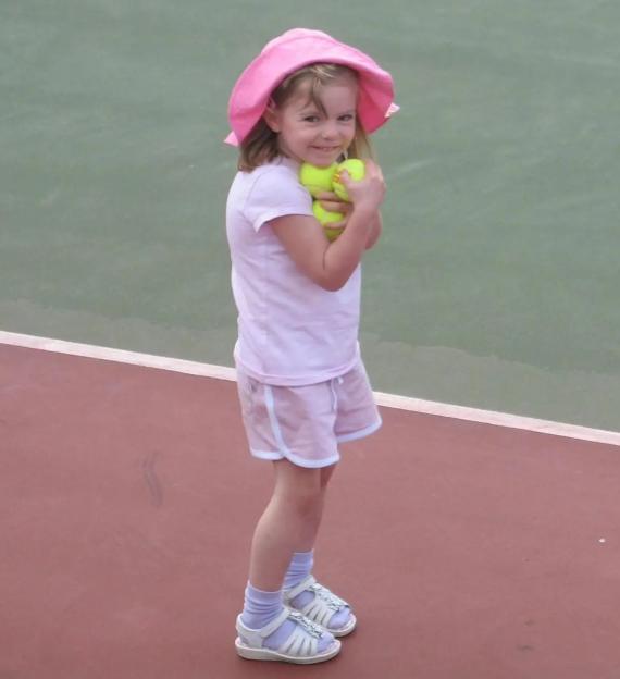 Photo of Madeleine McCann holding tennis balls.