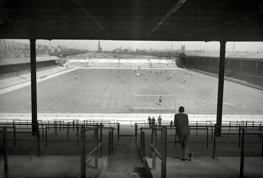 Black and white photo of a soccer game at Stoke City's Victoria Ground in 1947-48.