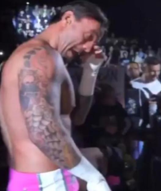 CM Punk crying after a WWE event.