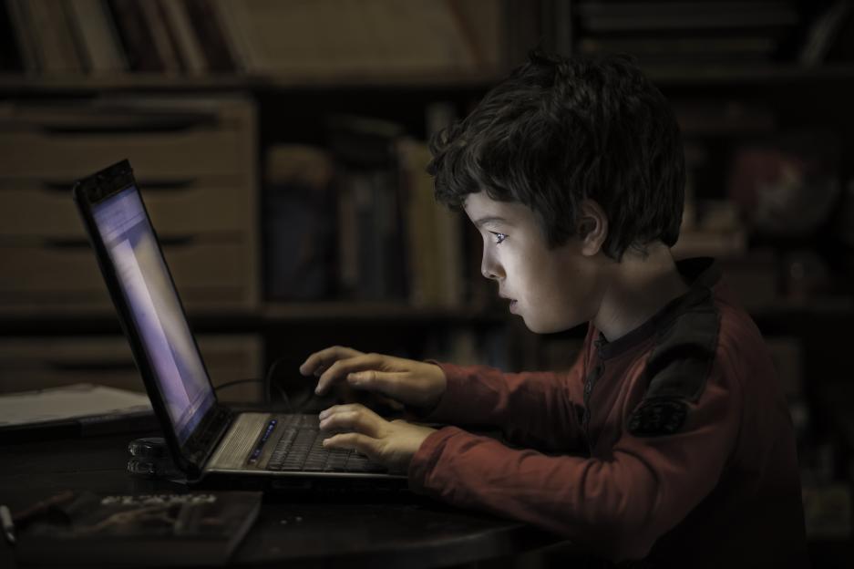 Child using a laptop.