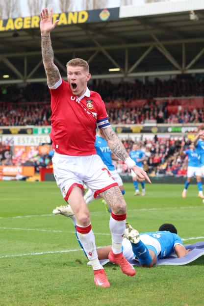 Soccer player appealing a handball call.