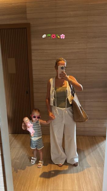 Mirror selfie of a woman and toddler in Dubai.