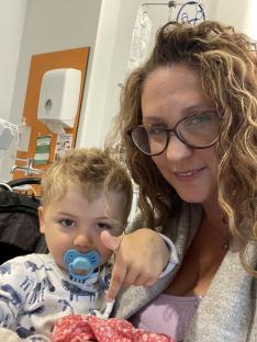 A mother and her young son in a hospital.
