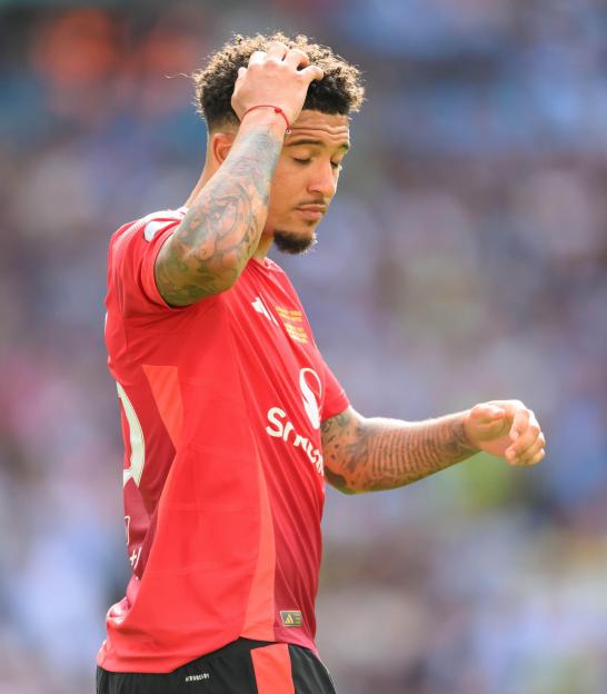 Jadon Sancho of Manchester United reacting after missing a penalty shootout.