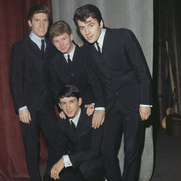 The Searchers, a British Merseybeat band, backstage in matching suits.