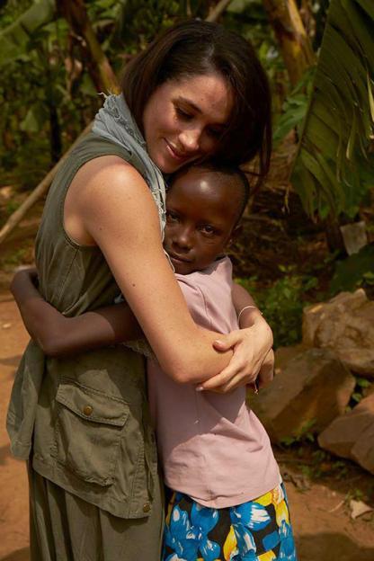 Meghan Markle hugging a child in Rwanda.