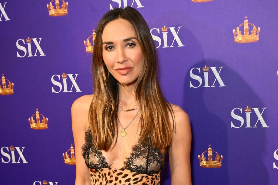 Braless Myleene Klass wows in plunging leopard print dress that shows off her stunning figure at Six The Musical