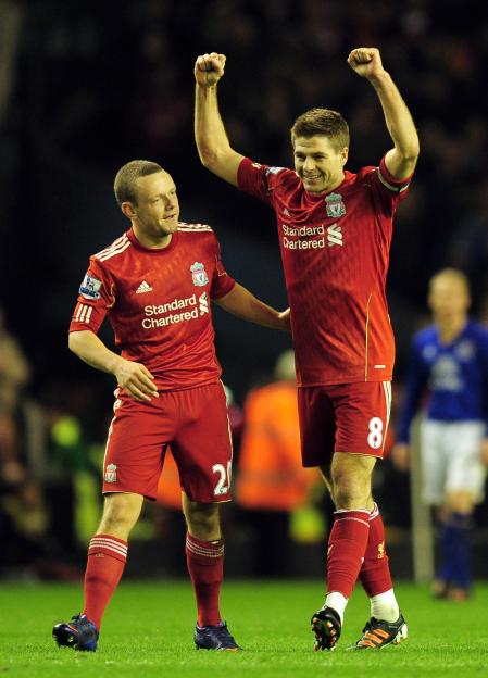 Jay Spearing and Steven Gerrard of Liverpool celebrating a victory.