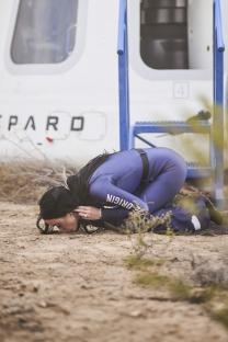 Katy Perry kissing the ground after a Blue Origin spaceflight.
