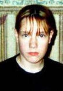 Photo of a young person with red hair.